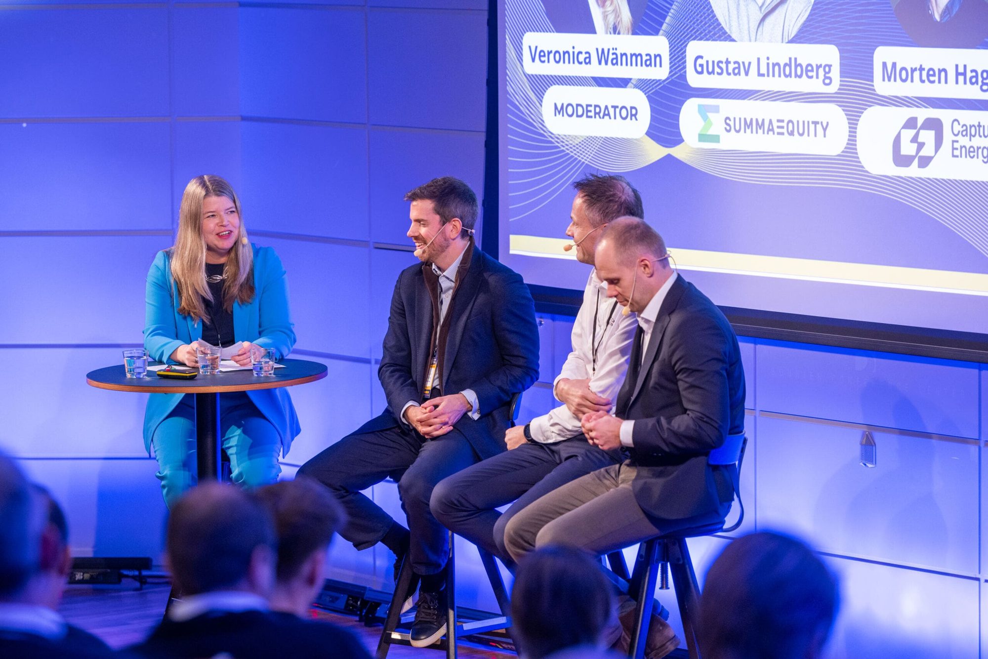 A panel on the Sweden Sustaintech Venture Day stage under blue light